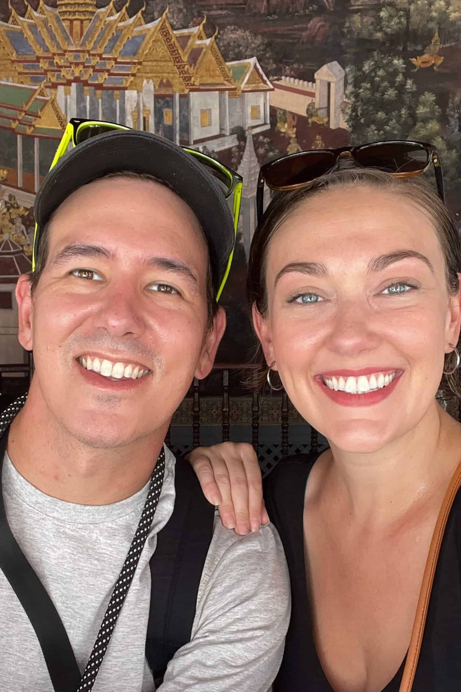 Ashley and Mike smiling at the Grand Palace in Bangkok.
