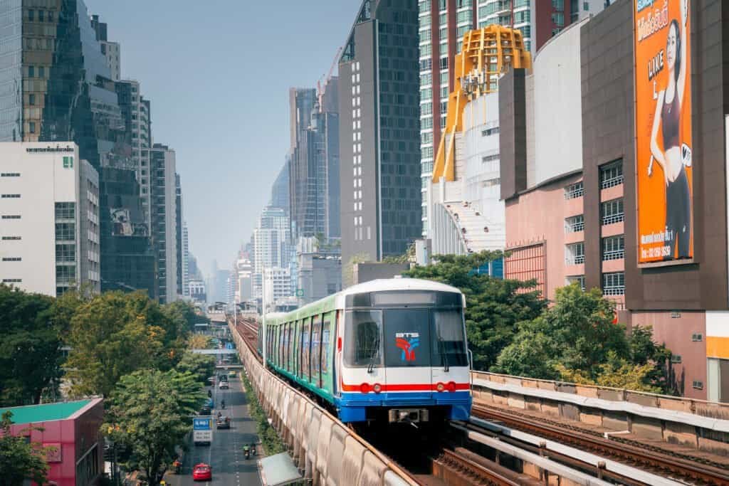 BTS Skytrain traveling on elevated tracks through central Bangkok