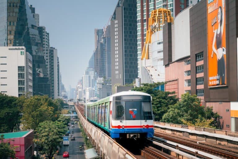 BTS Skytrain traveling on elevated tracks through central Bangkok