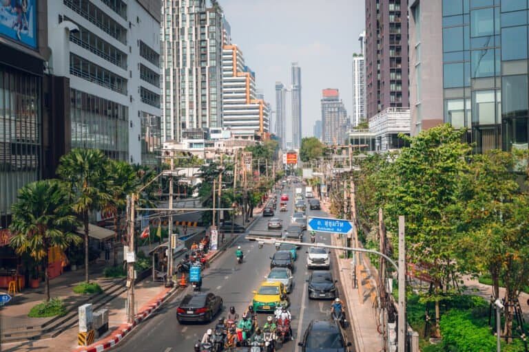 Traffic and motorbikes on Sukhumvit Road in Bangkok during the day