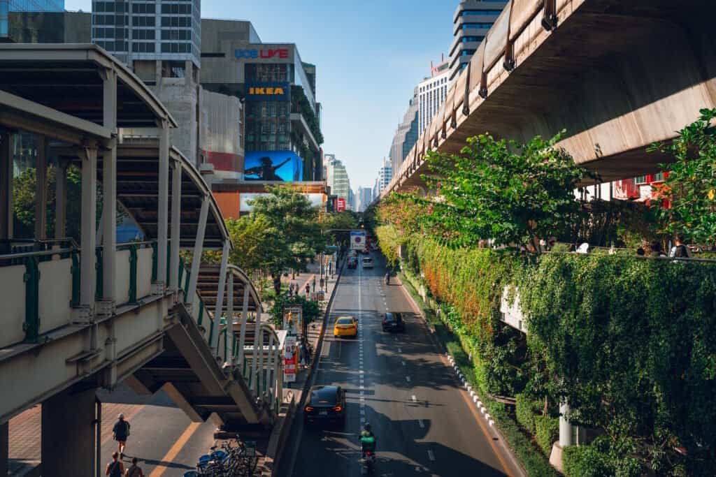 View of Sukhumvit Road in Bangkok with traffic and elevated walkways
